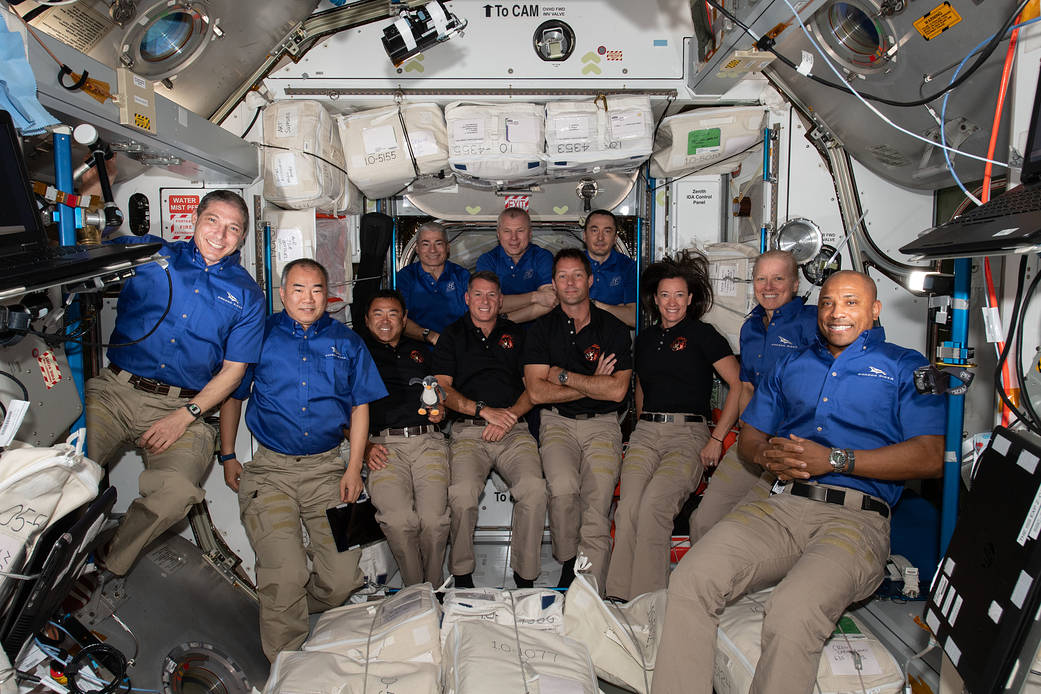 The 11-member crew aboard the International Space Station