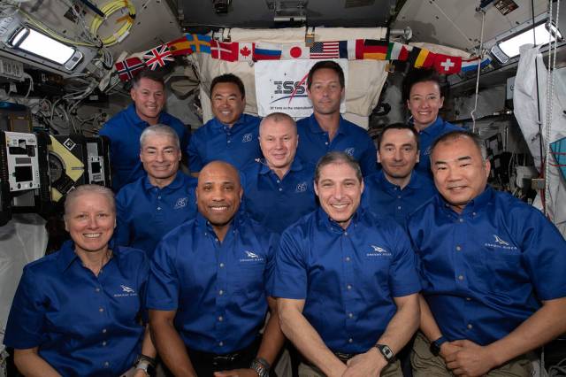 The 11-member crew aboard the International Space Station
