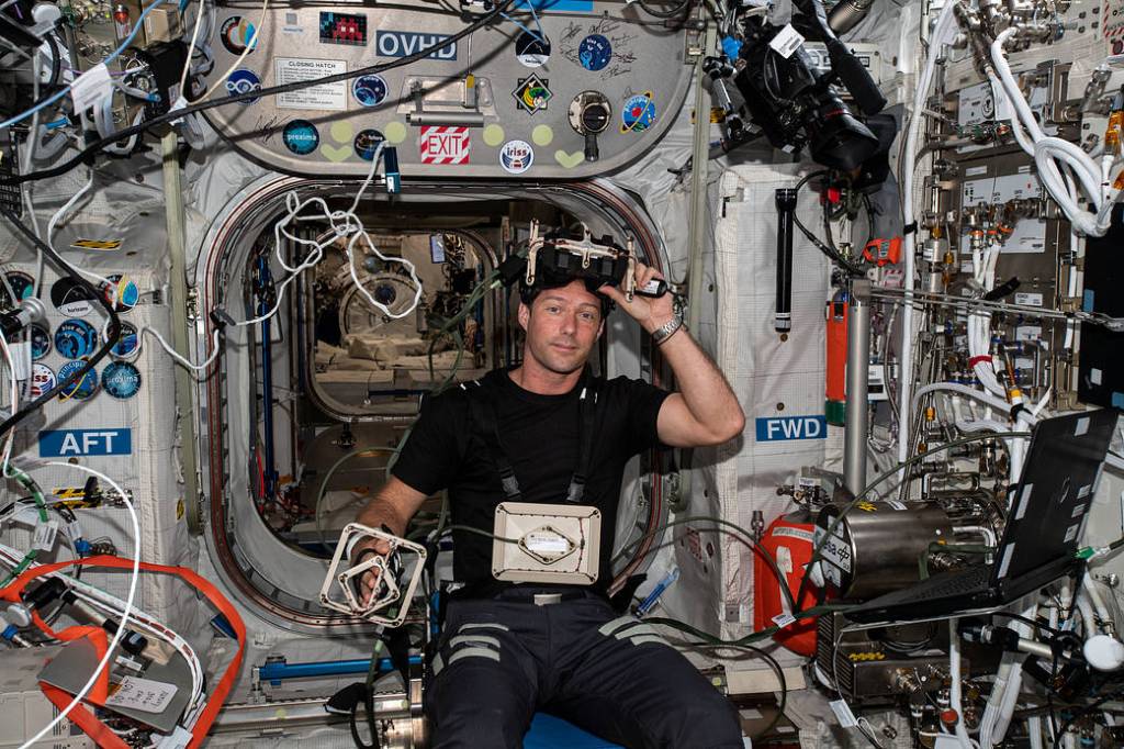 ESA astronaut Thomas Pesquet is seated for the GRASP experiment