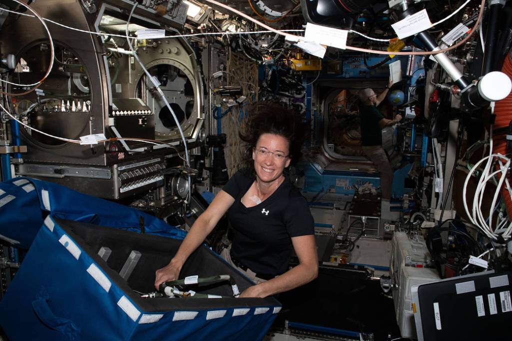 Astronaut Megan McArthur stows science hardware