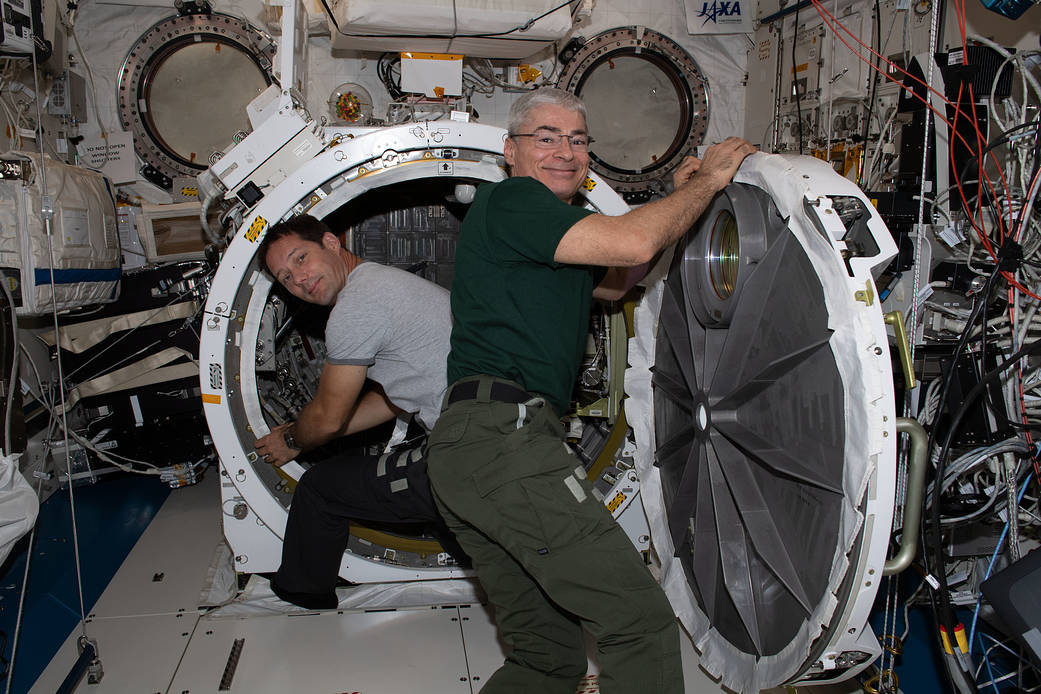Astronauts Thomas Pesquet and Mark Vande Hei work inside Kibo