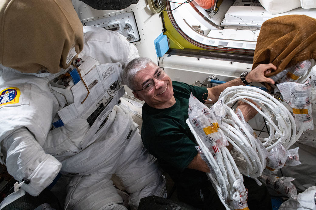 NASA astronaut Mark Vande Hei gathers spacewalking tools
