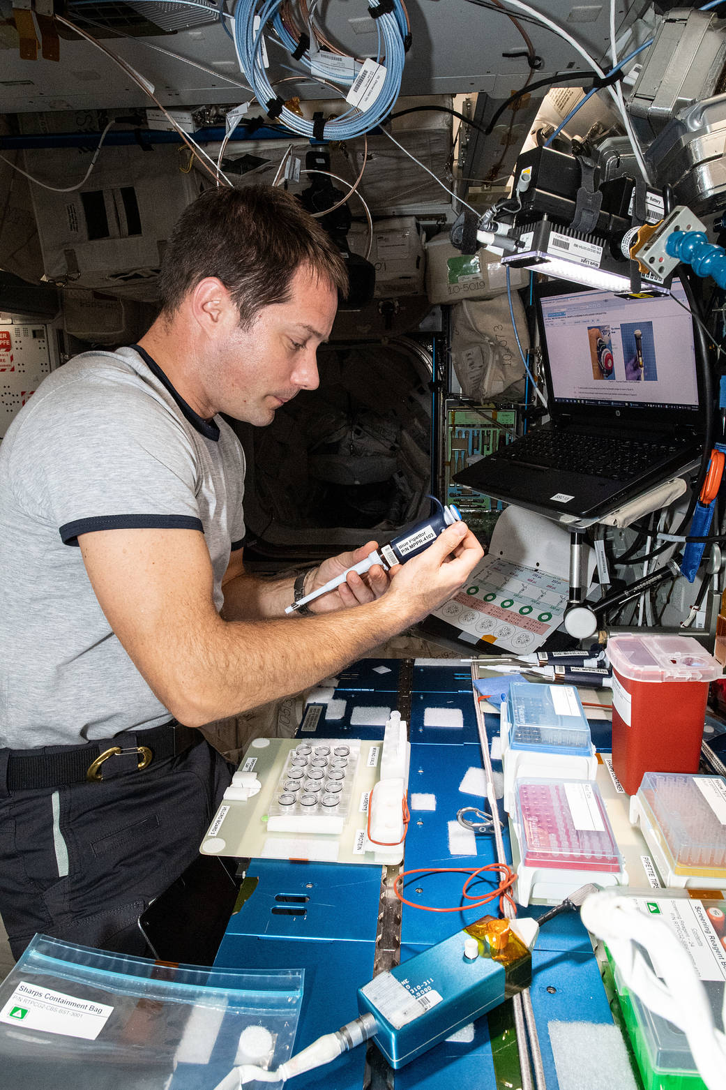 Astronaut Thomas Pesquet services protein crystal samples
