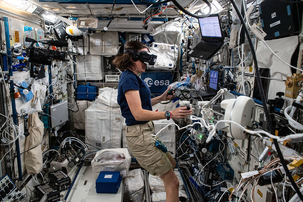 Astronaut Megan McArthur wears virtual reality gear for an experiment