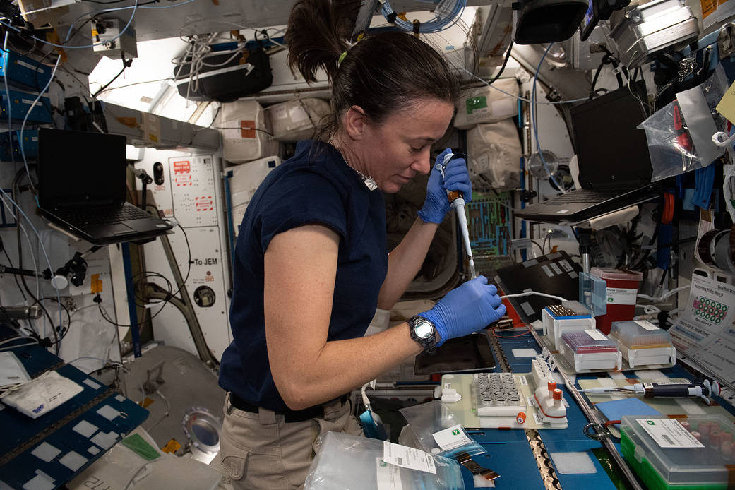 NASA astronaut Megan McArthur loads protein crystallography plates