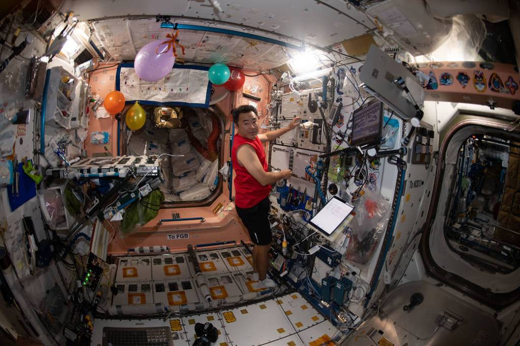 Astronaut Akihiko Hoshide in the balloon-decorated Unity module