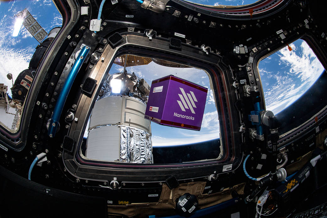 A NanoRacks module free-floats inside the cupola