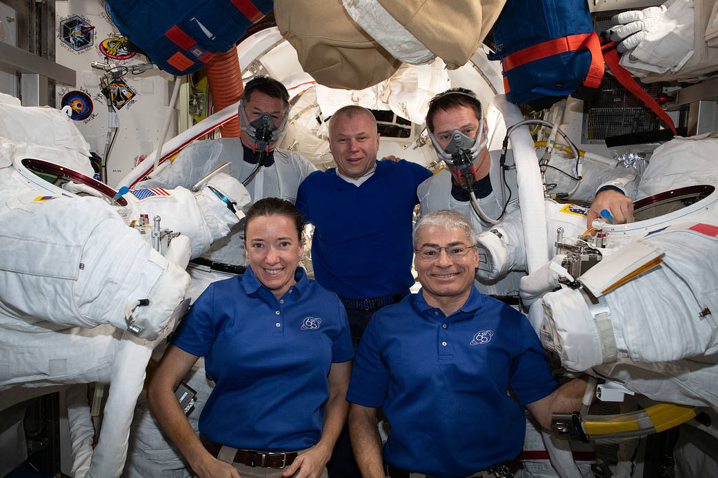Expedition 65 crew members supporting spacewalkers