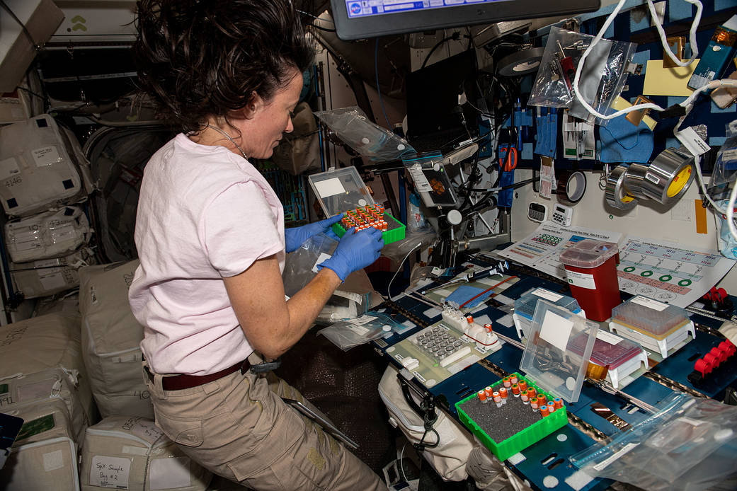 Astronaut Megan McArthur loads protein crystallography plates