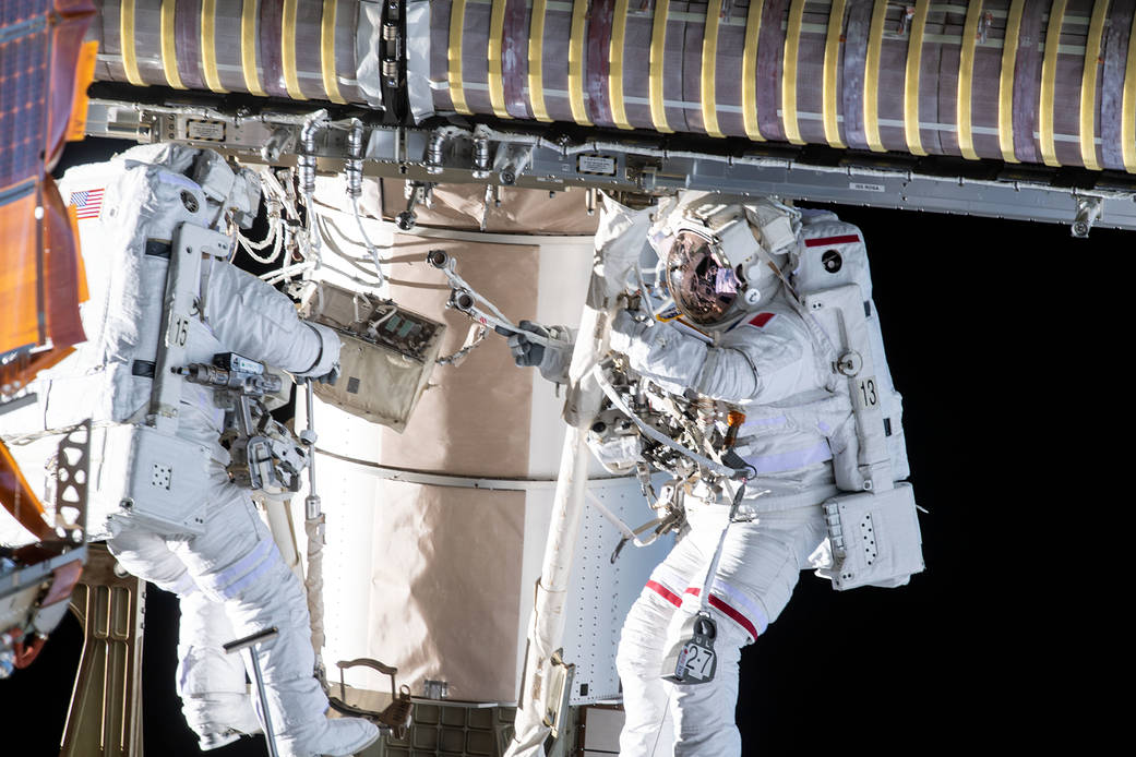 Spacewalkers Shane Kimbrough and Thomas Pesquet during solar array installation