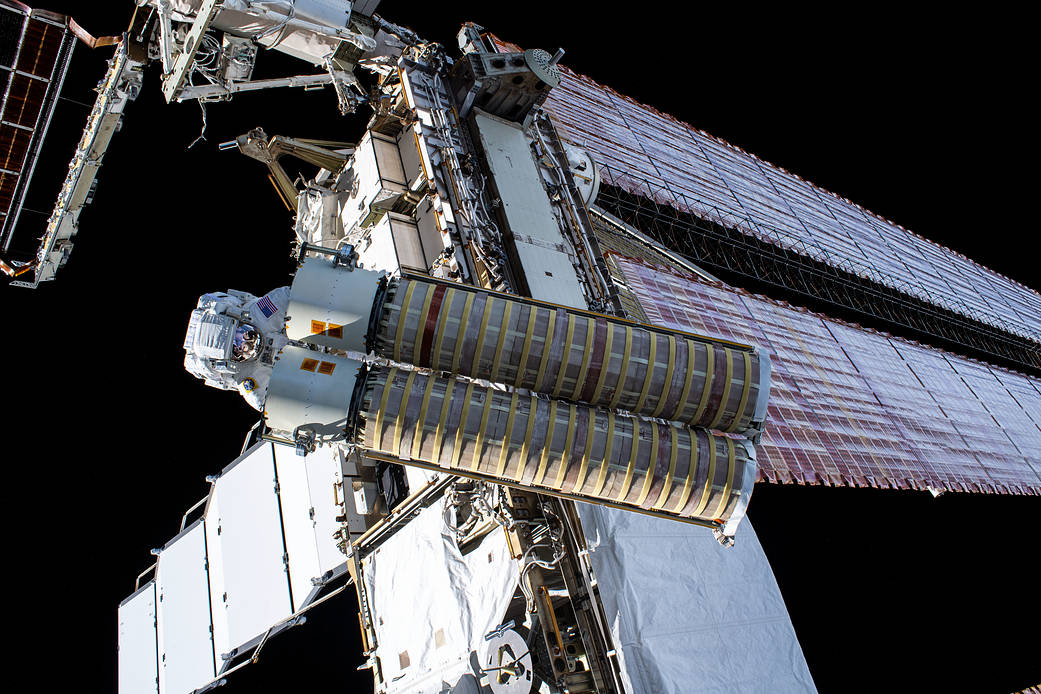 NASA spacewalker Shane Kimbrough carries the second roll out solar array