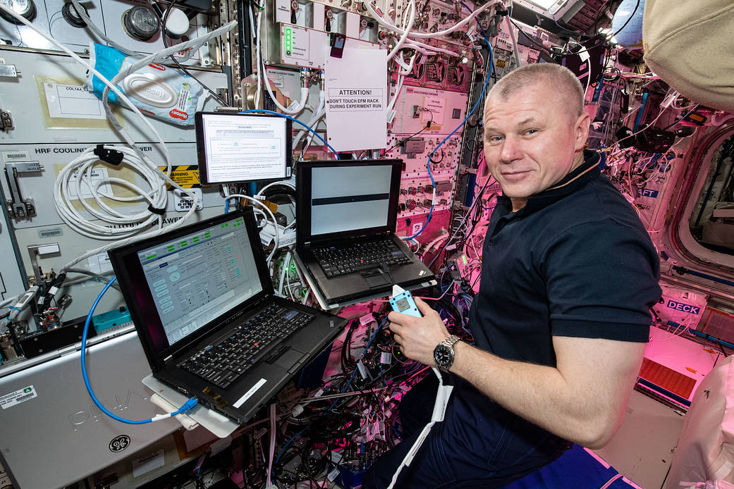Cosmonaut Oleg Novitskiy works on the Plasma Kristall-4 experiment