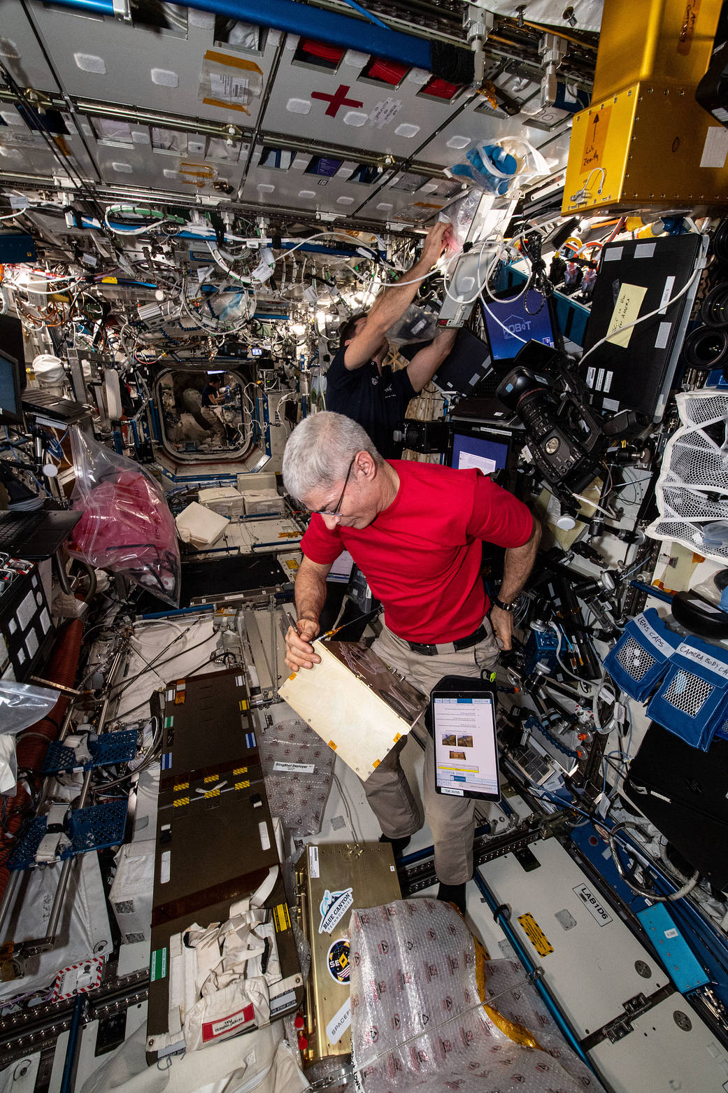 Astronauts Mark Vande Hei and Thomas Pesquet work on a variety of tasks