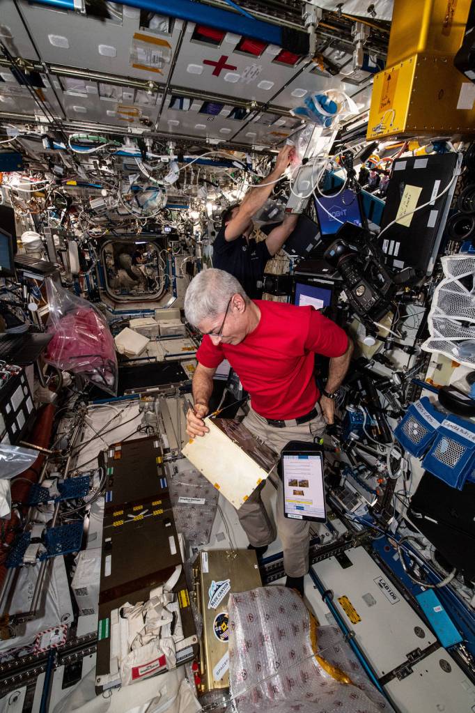 Astronauts Mark Vande Hei and Thomas Pesquet work on a variety of tasks
