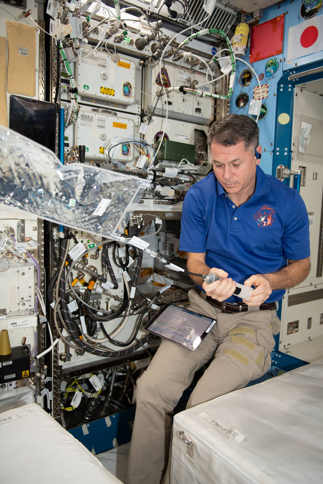 Astronaut Shane Kimbrough configures the Advanced Plant Habitat