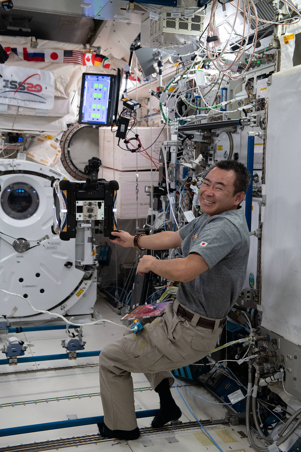 Commander Akihiko Hoshide configures the Astrobee robotic free-flyer