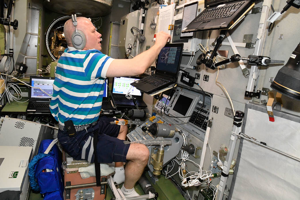 Cosmonaut Oleg Novitskiy practices remote spacecraft maneuvering techniques