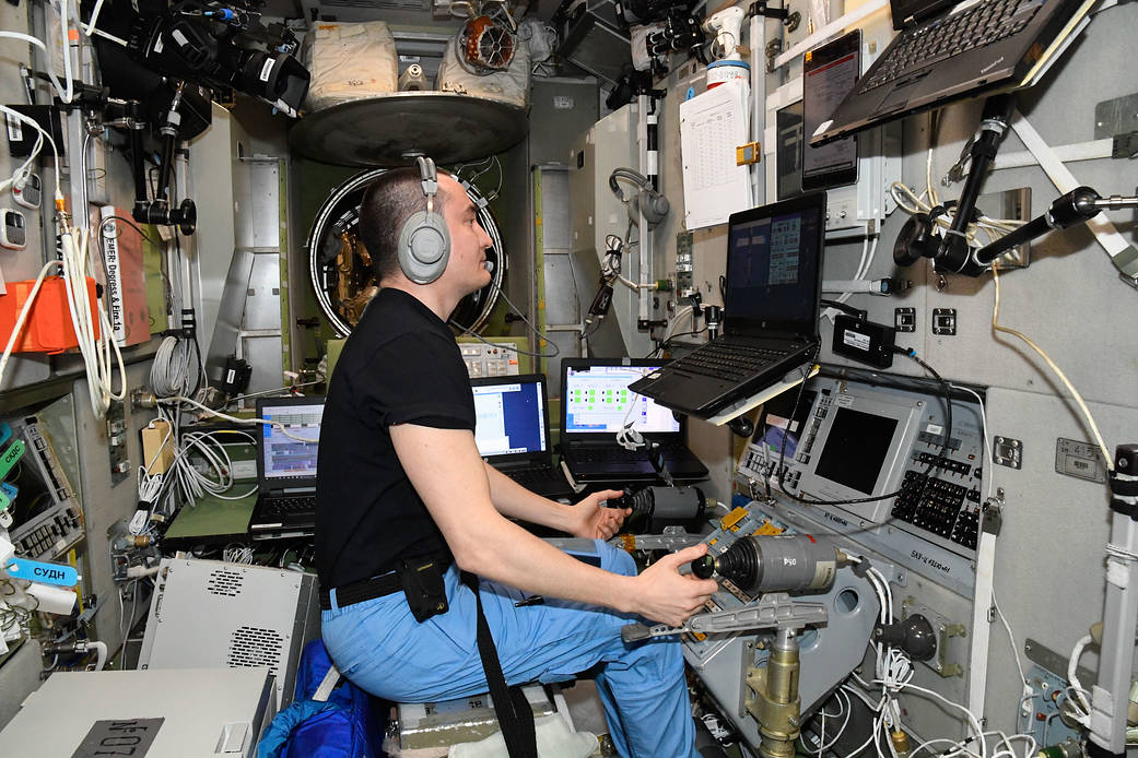 Cosmonaut Pyotr Dubrov practices remote spacecraft maneuvering techniques