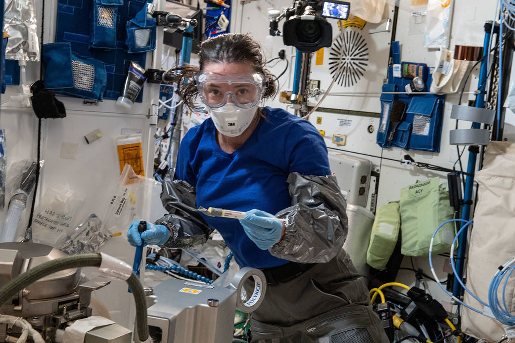 Astronaut Megan McArthur works on orbital plumbing tasks