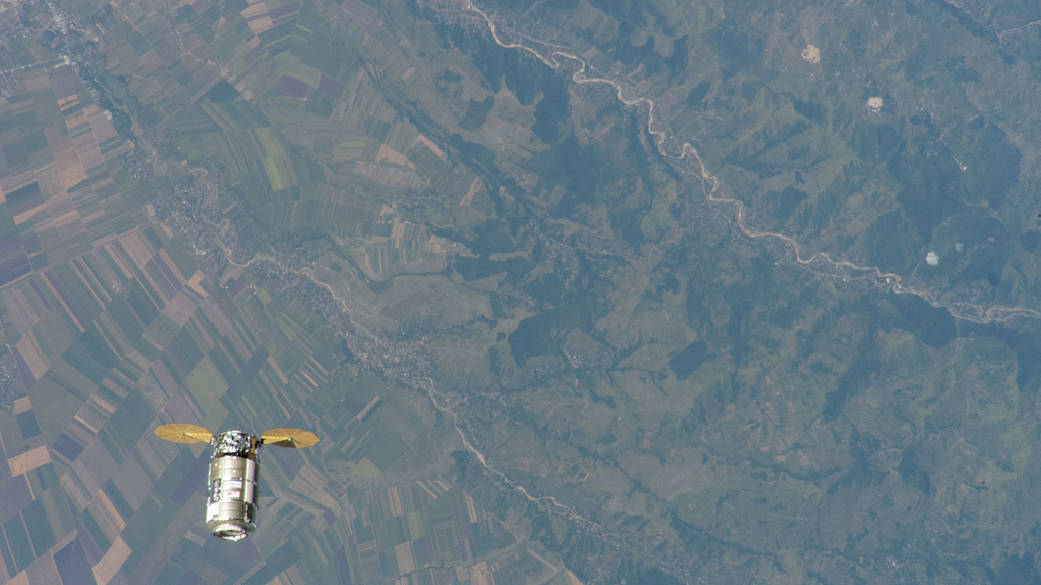The Cygnus space freighter approaches the space station