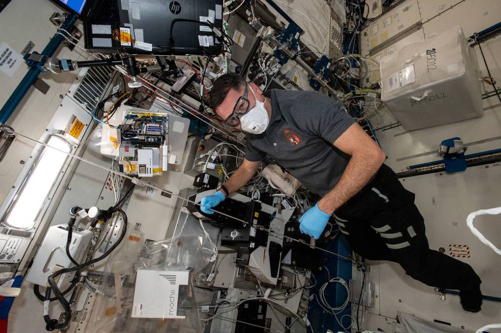 Shane Kimbrough works on a miniature electron microscope