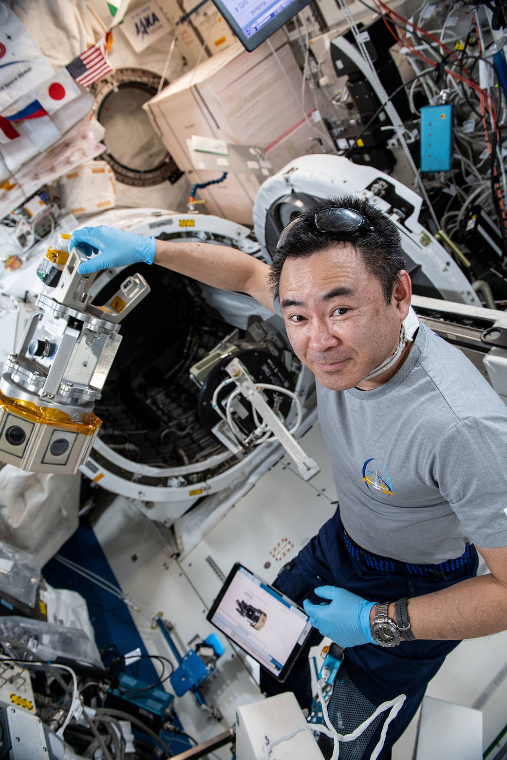 Commander Akihiko Hoshide sets up a virtual reality camera