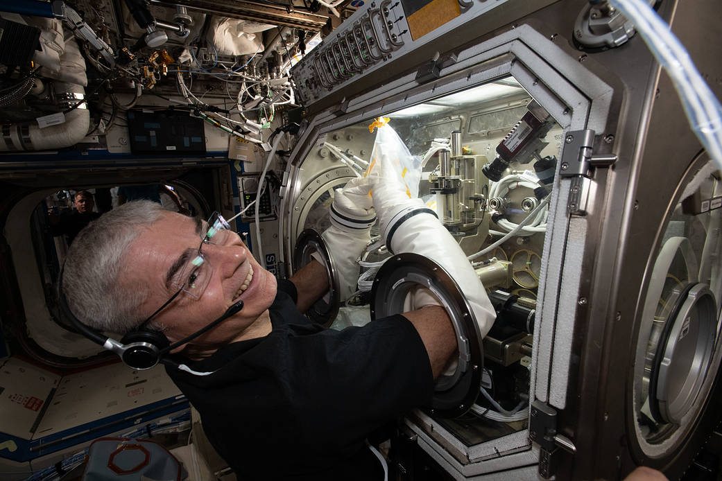 Astronaut Mark Vande Hei works inside the Microgravity Science Glovebox