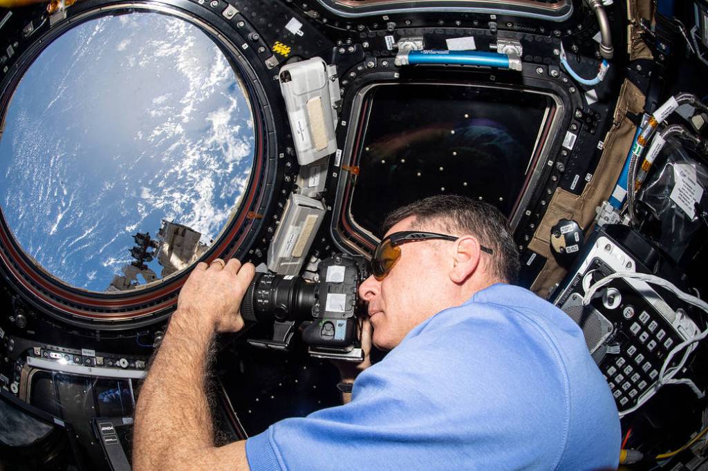 Astronaut Shane Kimbrough takes photographs of the Earth below