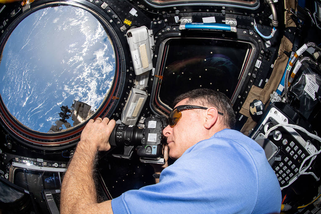Astronaut Shane Kimbrough takes photographs of the Earth below