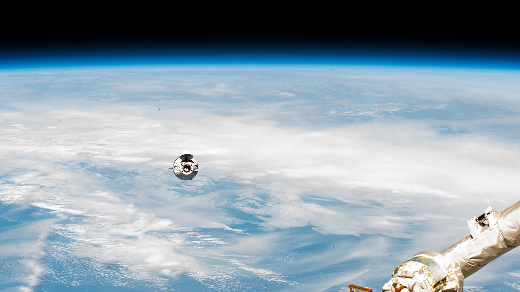 The SpaceX Cargo Dragon approaches the station