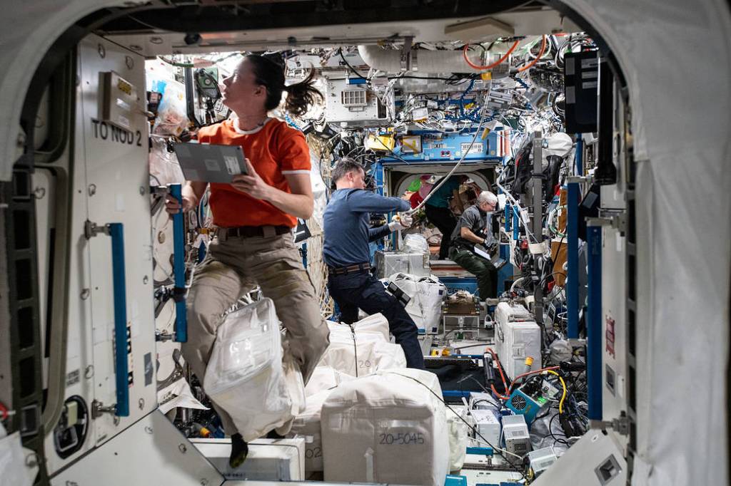 NASA astronauts work in the U.S. Destiny laboratory module