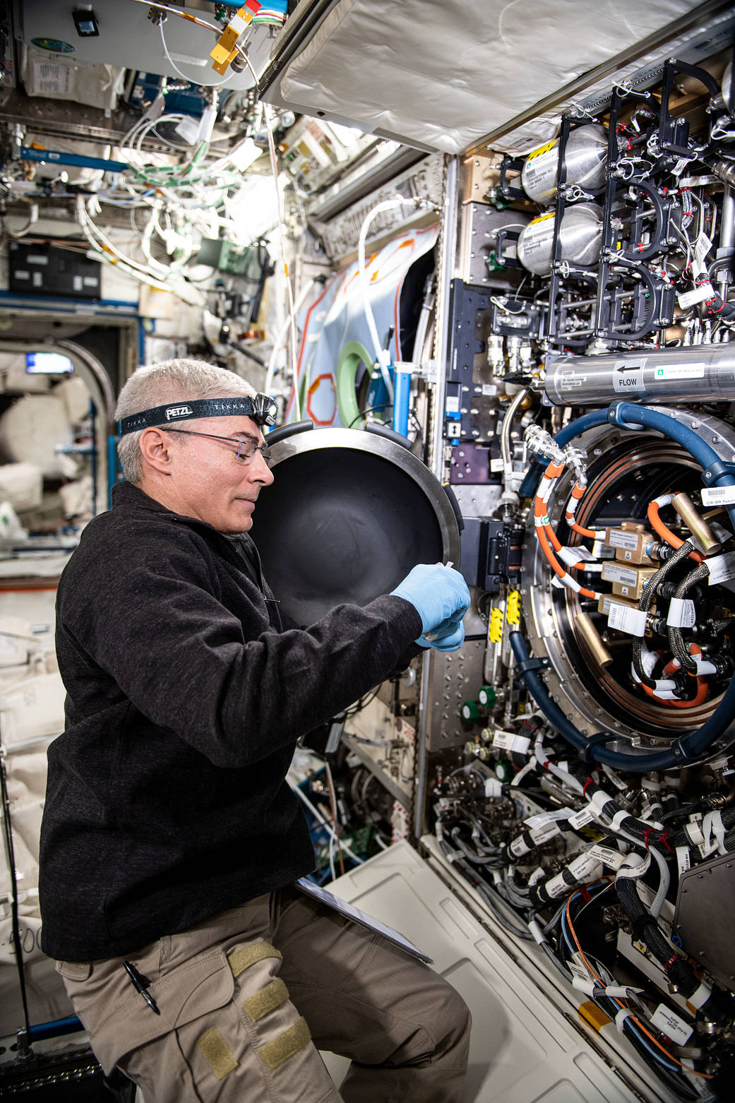 Astronaut Mark Vande Hei works on the Combustion Integrated Rack