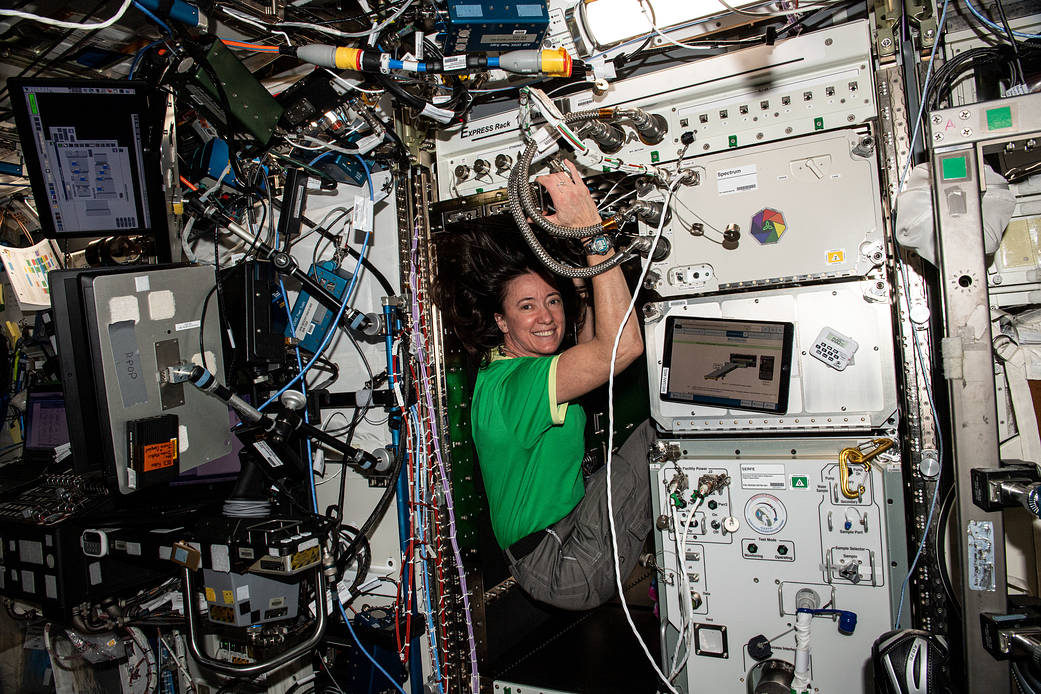 Astronaut Megan McArthur configures an EXPRESS rack