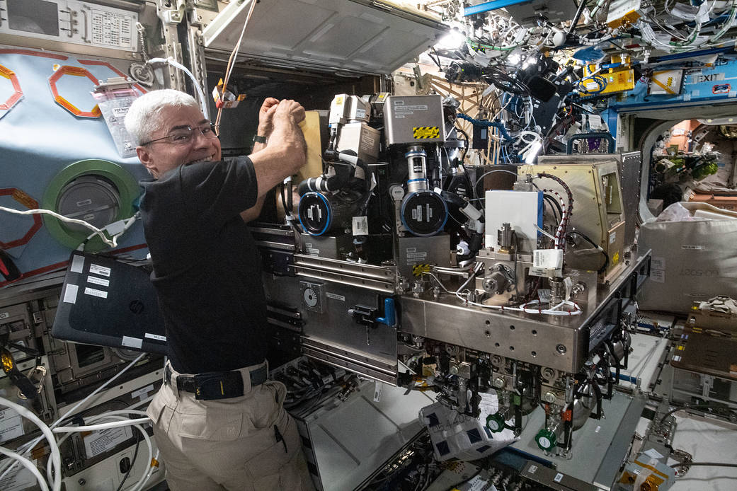 Astronaut Mark Vande Hei works inside the Combustion Integrated Rack