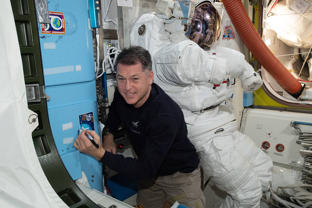 Astronaut Shane Kimbrough signs the station vestibule
