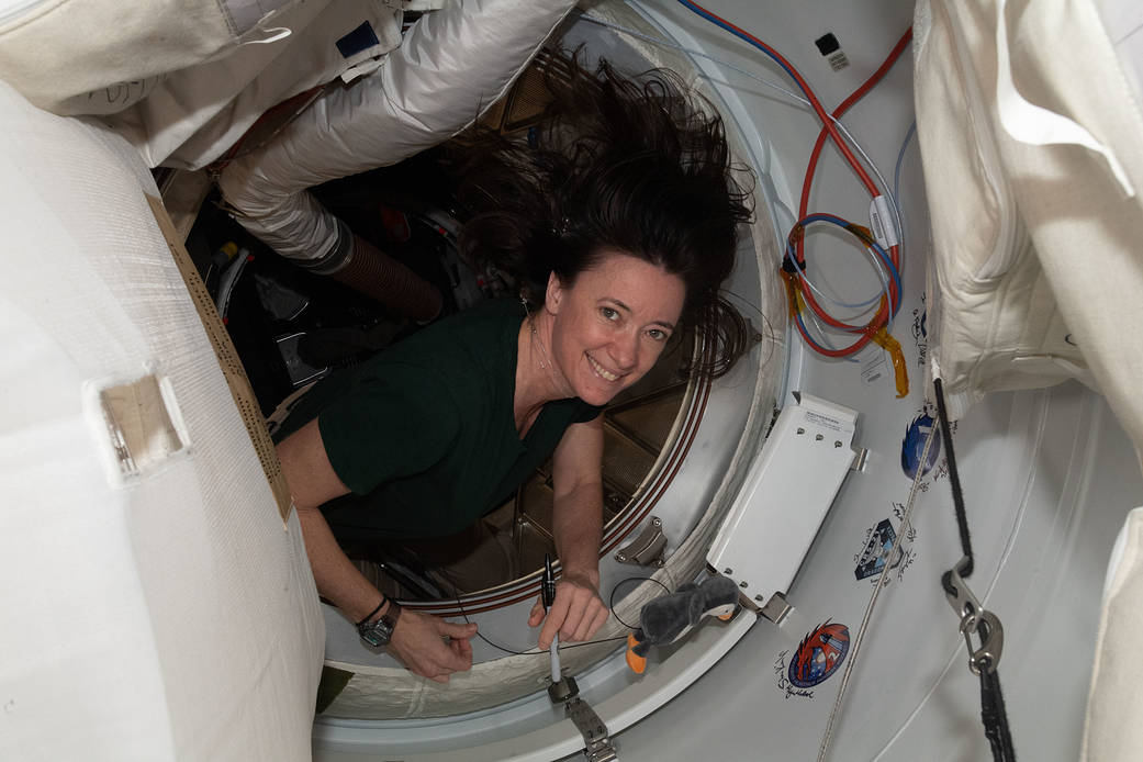 Astronaut Megan McArthur signs the station vestibule