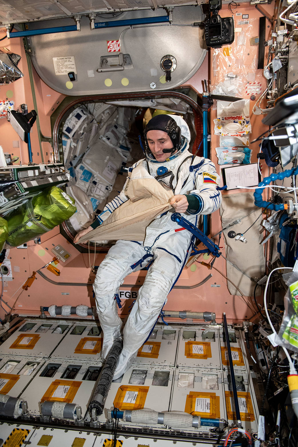 Cosmonaut Pyotr Dubrov tries on the Sokol launch and entry suit