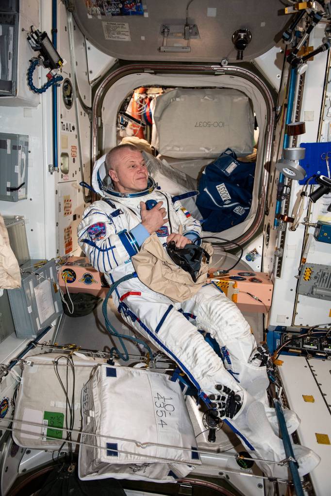Cosmonaut Oleg Novitskiy tries on the Sokol launch and entry suit