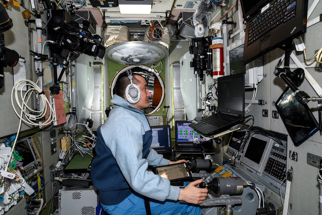 Cosmonaut Pyotr Dubrov trains on a computer.