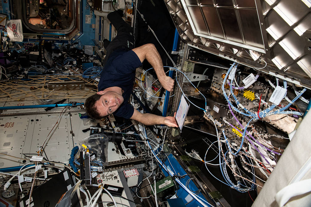 Astronaut Thomas Pesquet installs a router