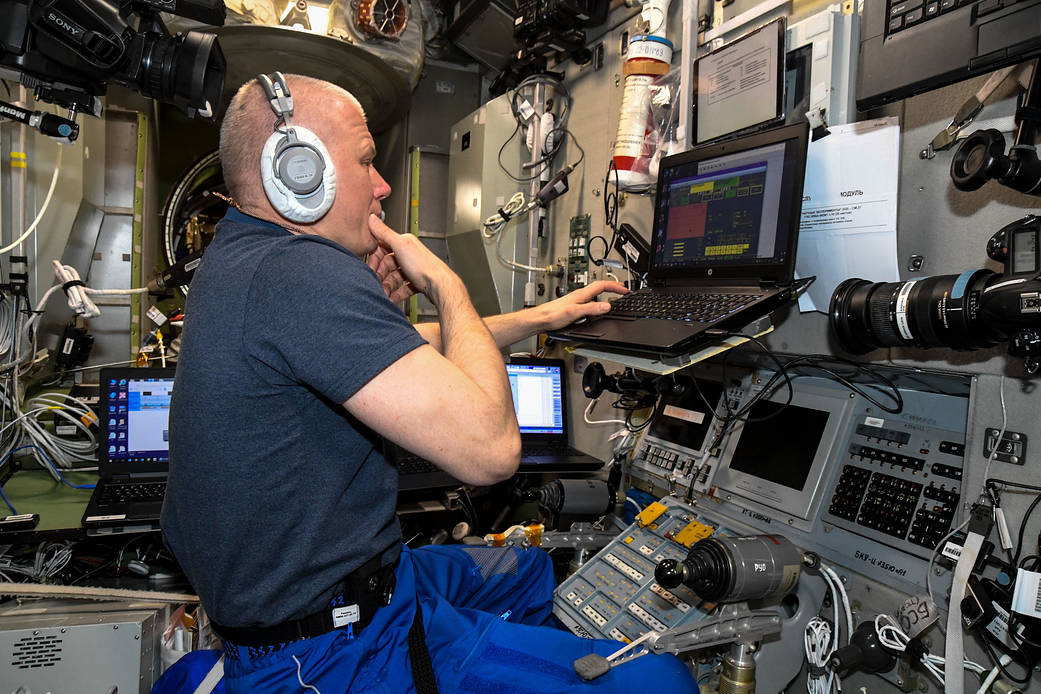 Cosmonaut Oleg Novitskiy during a training session on a computer