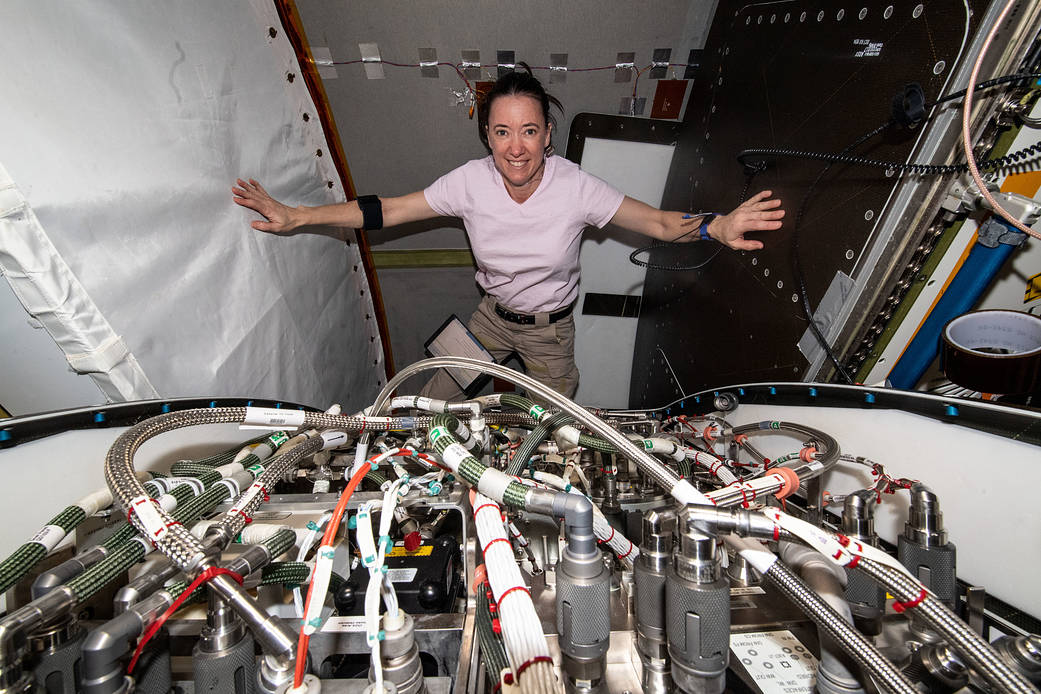 Astronaut Megan McArthur works on life support gear