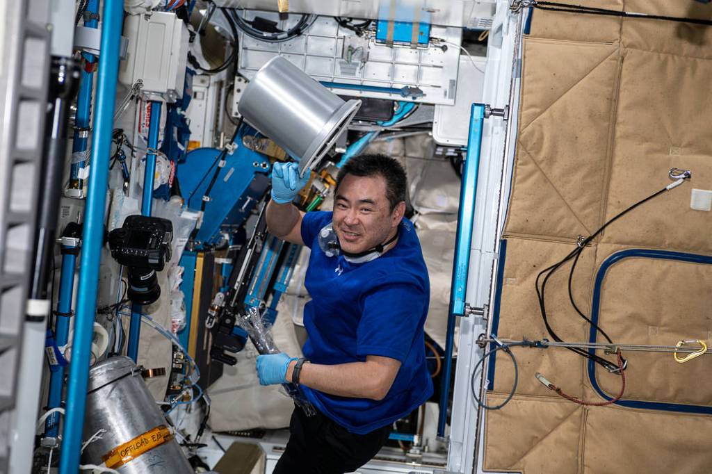 Astronaut Akihiko Hoshide works on orbital plumbing tasks