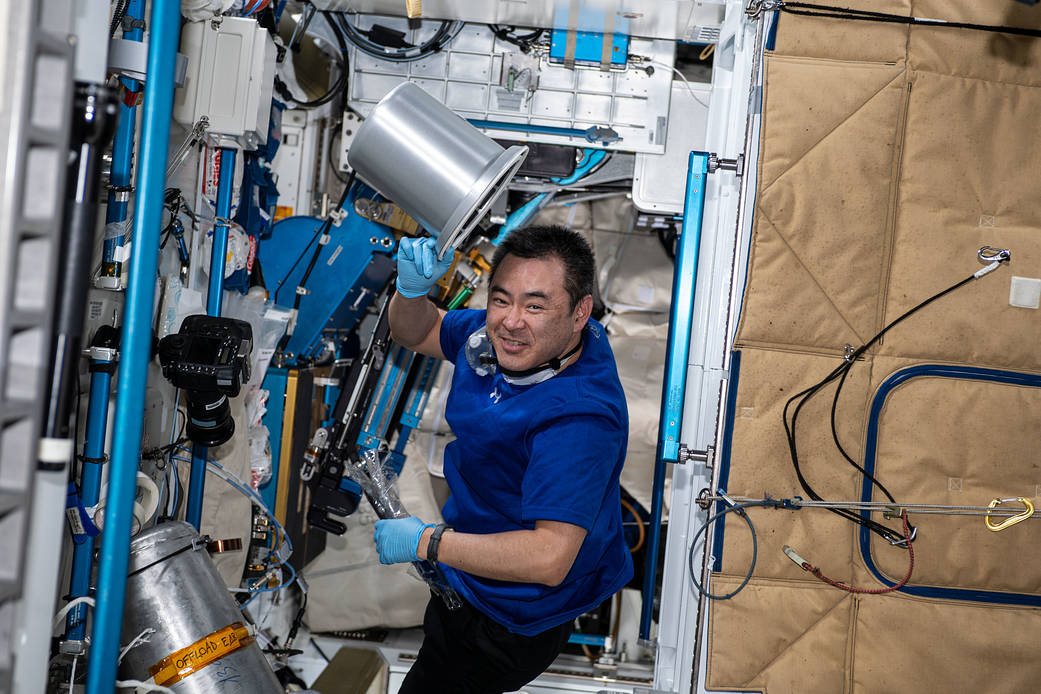 Astronaut Akihiko Hoshide works on orbital plumbing tasks
