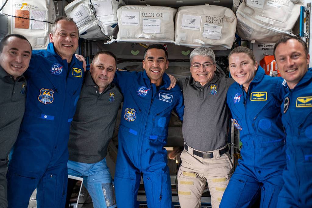 The seven-member Expedition 66 crew poses for a portrait