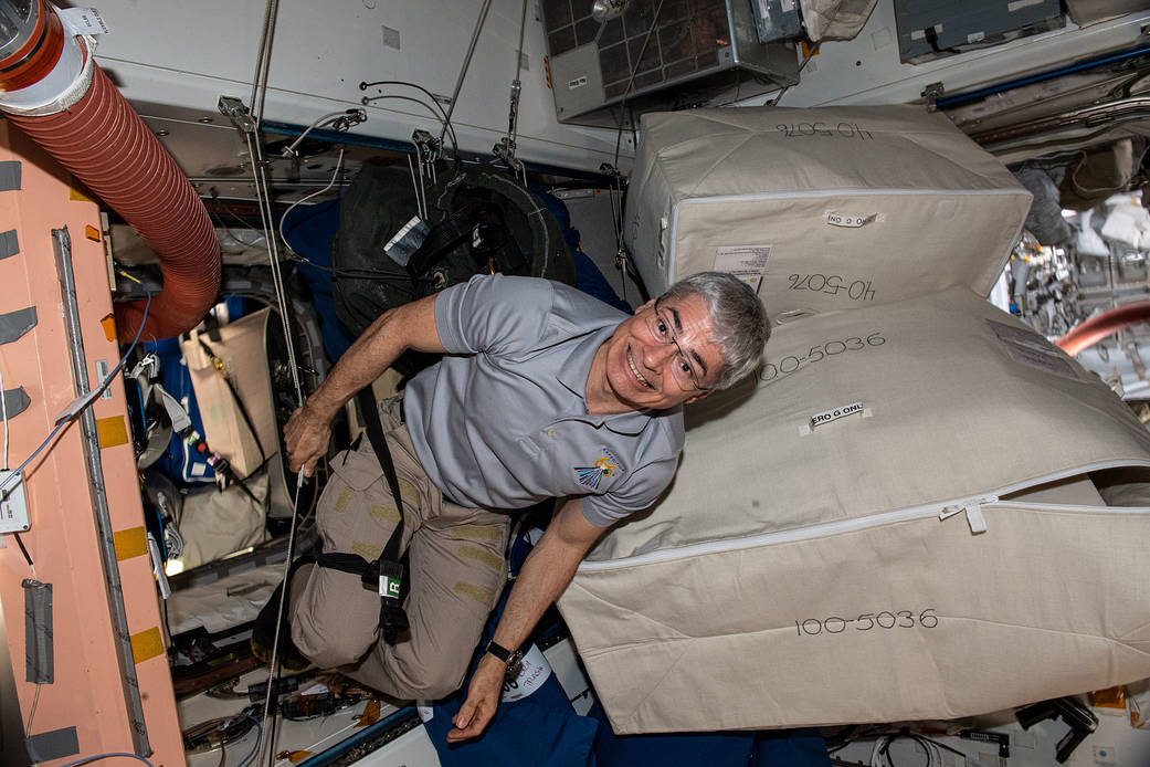 Astronaut Mark Vande Hei works maintenance and cargo activities