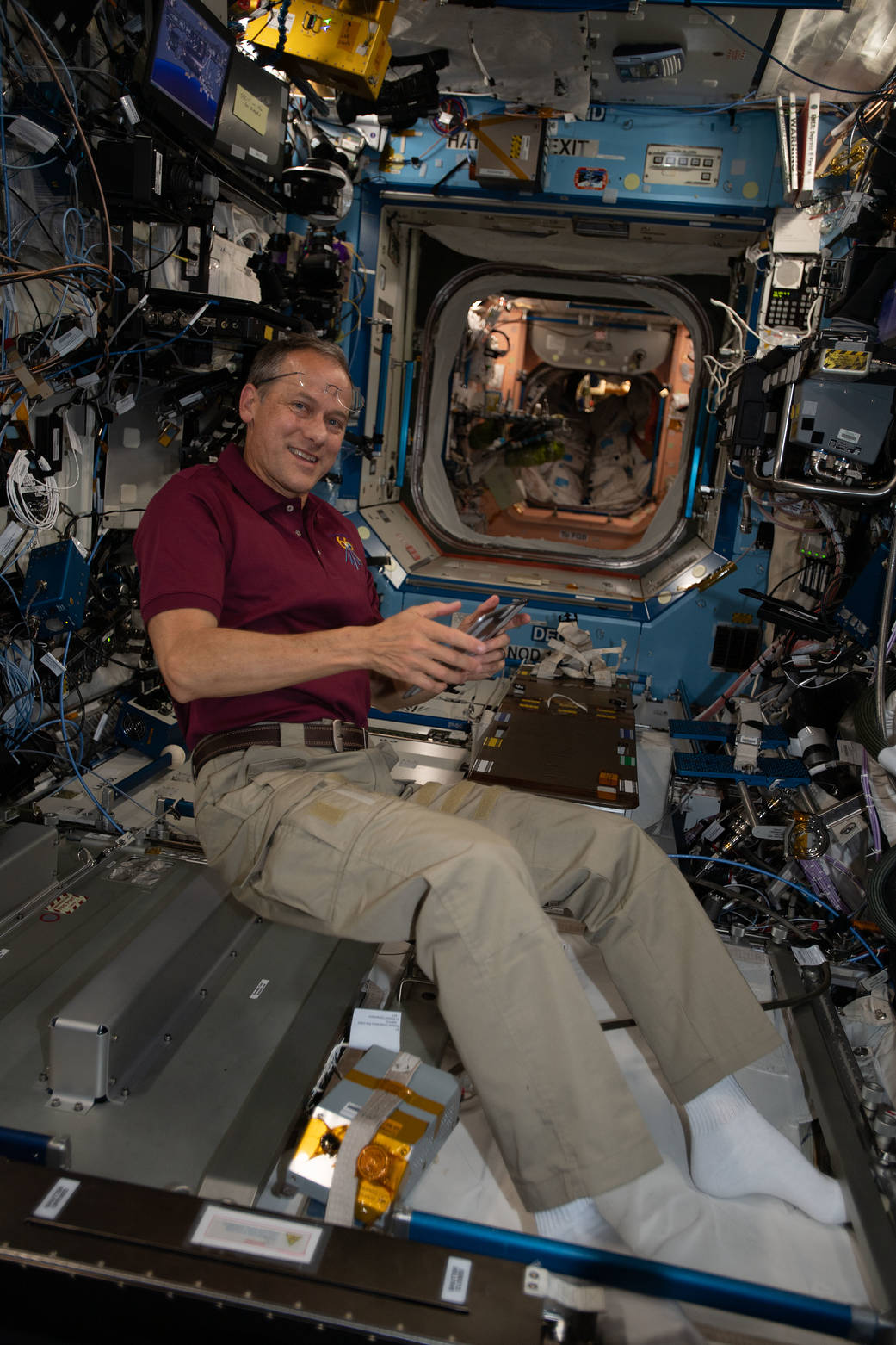 Astronaut Thomas Marshburn collects potable water samples