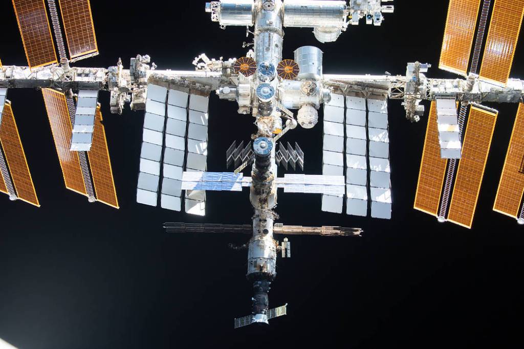 The space station is pictured from the SpaceX Crew Dragon