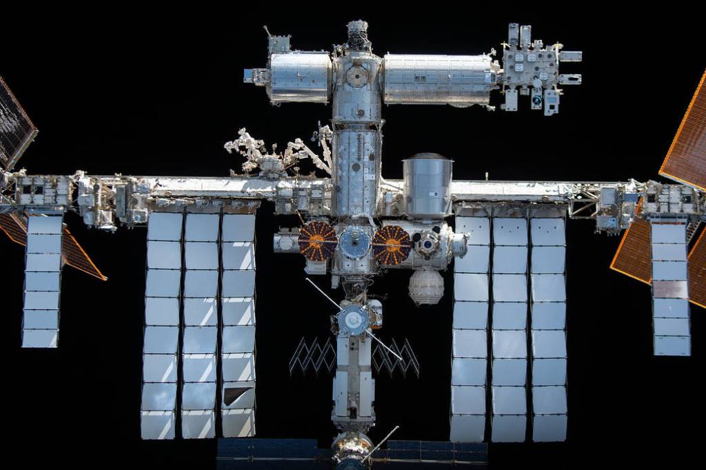 The space station is pictured from the SpaceX Crew Dragon