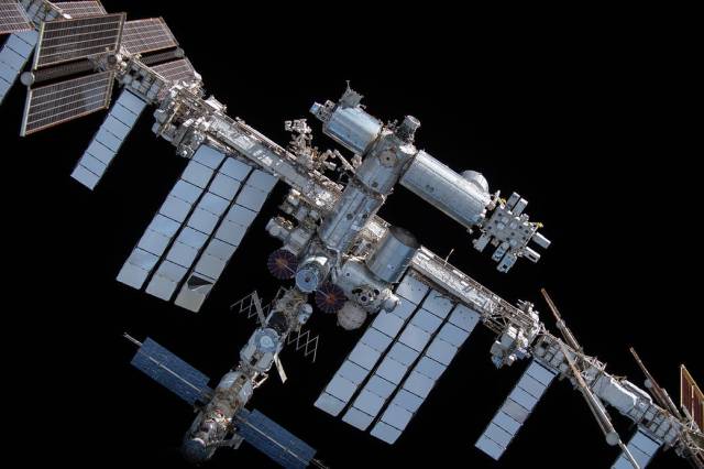 The space station is pictured from the SpaceX Crew Dragon